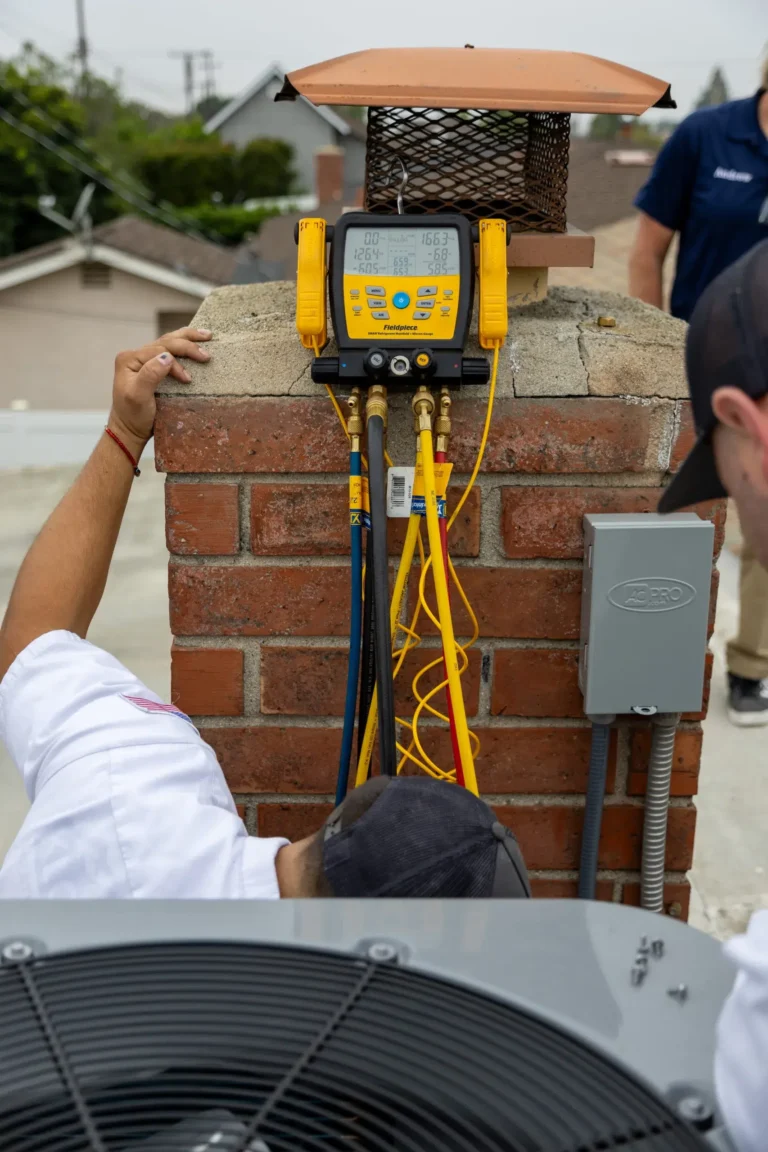Qualified technicians inspecting HVAC unit