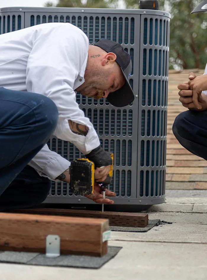 Technician Repairing Heating System