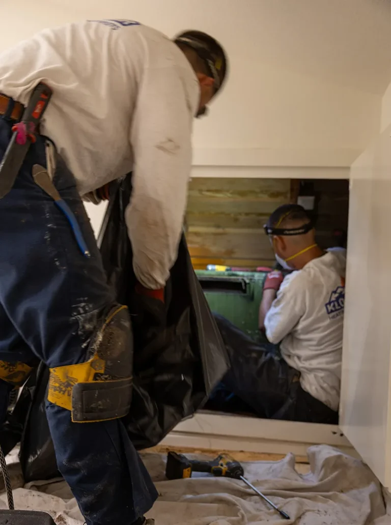 Technician Checking Air Duct for Improving Air Quality