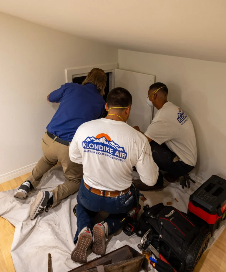 HVAC Technicians Inspecting Air Ducts for Cleaning
