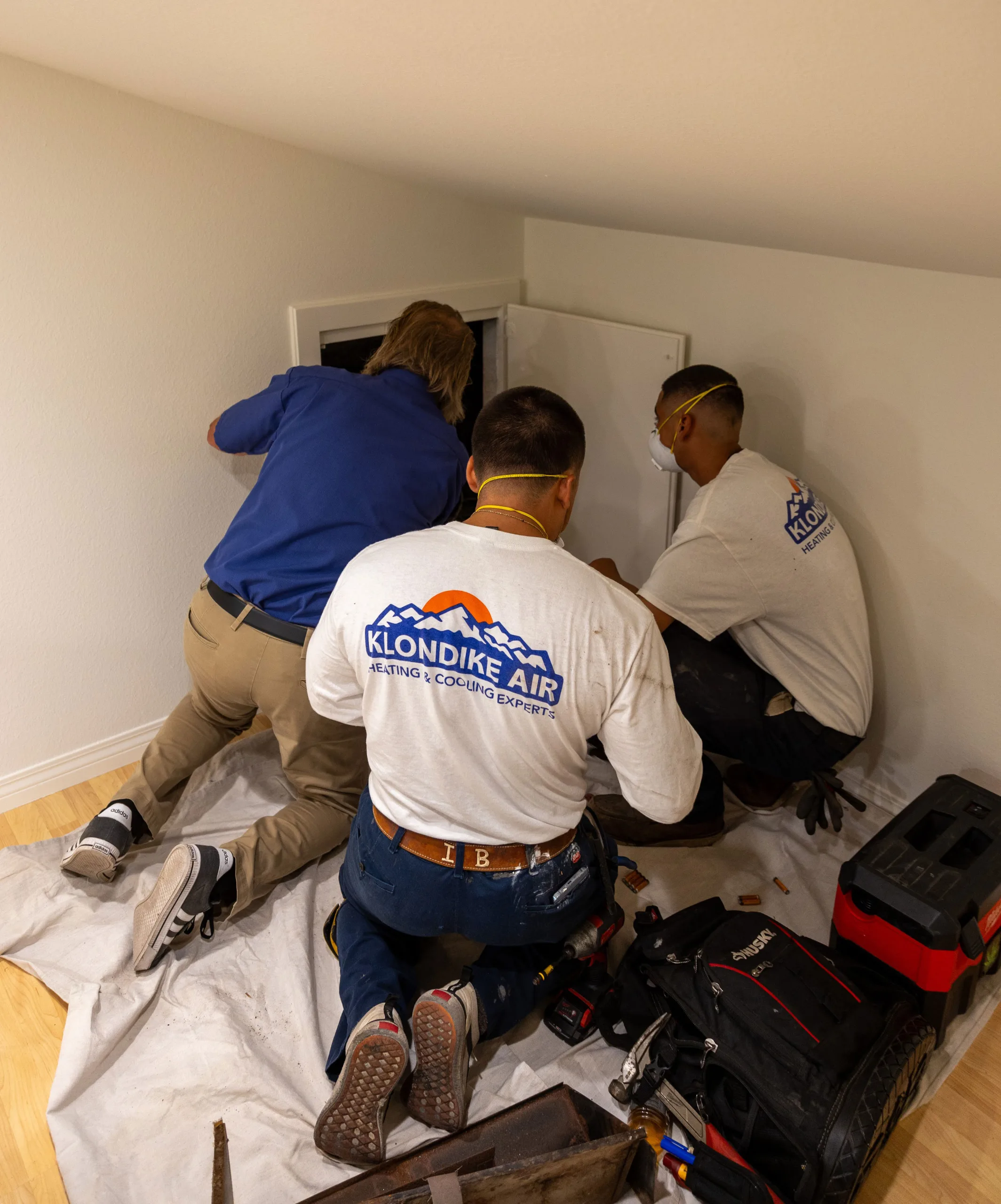 HVAC Technicians Inspecting Air Ducts for Cleaning