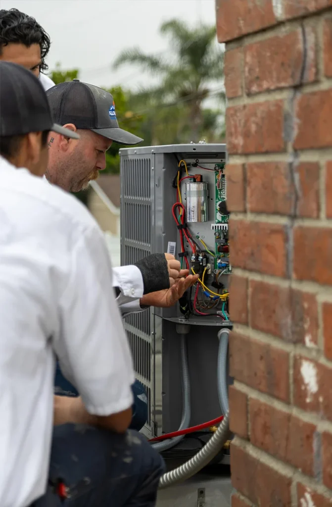 HVAC Technician Repairing AC Unit