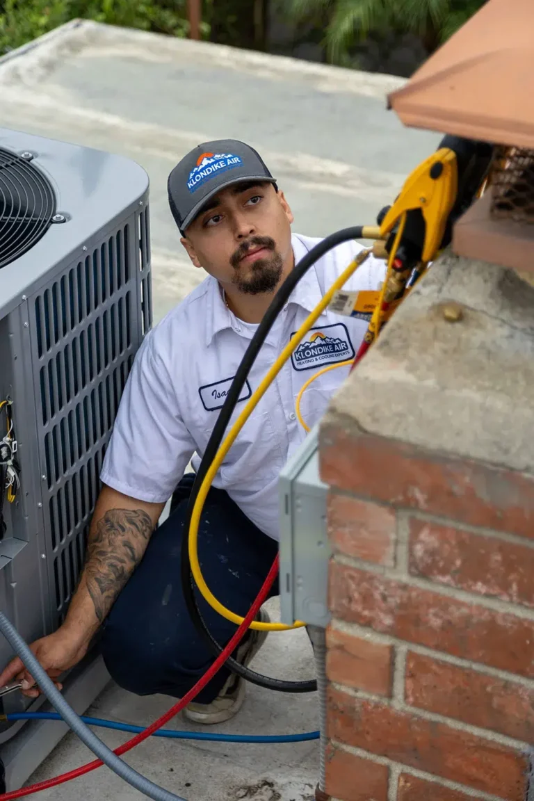 HVAC Technician Inspecting AC Unit in Newport Beach